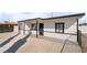 Newly remodeled home with a modern exterior and a gravel front yard at 214 W Atlantic Ave, Henderson, NV 89015