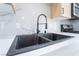 Modern kitchen sink with a sleek black finish at 214 W Atlantic Ave, Henderson, NV 89015