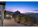 Relaxing backyard patio with mountain views at dusk at 23 Via Tavolara, Henderson, NV 89011