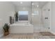 Spa-like bathroom with soaking tub, walk-in shower, and modern vanity at 23 Via Tavolara, Henderson, NV 89011