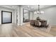 Elegant dining room with large mirrors and chandelier at 23 Via Tavolara, Henderson, NV 89011