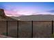 Stunning panoramic view of the city skyline at dusk at 23 Via Tavolara, Henderson, NV 89011