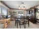 Charming dining room with wood hutch and table for six at 2353 Moorpark Way, Henderson, NV 89014