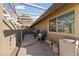 Covered patio with grill and outdoor seating at 2353 Moorpark Way, Henderson, NV 89014