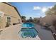 Sunny backyard showcasing a refreshing pool and spa, offering a relaxing outdoor retreat at 2353 Moorpark Way, Henderson, NV 89014