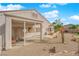 A landscaped backyard featuring a covered patio and desert landscaping at 2413 Cook Out Ct, Henderson, NV 89002