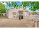 A house with a desert landscaped backyard, and a covered patio at 2413 Cook Out Ct, Henderson, NV 89002