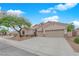 Charming single-story home boasts a well-manicured front yard, desert landscaping, and a spacious two-car garage at 2413 Cook Out Ct, Henderson, NV 89002