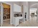 Hallway with decorative coffee bar and pantry with a view of the dining room at 2413 Cook Out Ct, Henderson, NV 89002