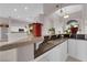 Kitchen bar featuring a sink and countertop with white cabinets at 2413 Cook Out Ct, Henderson, NV 89002