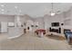 Bright living room featuring a fireplace and high ceilings at 2413 Cook Out Ct, Henderson, NV 89002