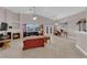 Spacious living room featuring tile flooring, a fireplace, a ceiling fan, and abundant natural light at 2413 Cook Out Ct, Henderson, NV 89002