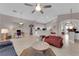 Open-concept living area featuring tile flooring, neutral paint, and seamless flow to other living spaces at 2413 Cook Out Ct, Henderson, NV 89002