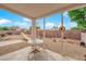 Covered patio featuring a table and chairs, overlooking the backyard at 2413 Cook Out Ct, Henderson, NV 89002