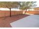 Landscaped backyard with small patio and rock garden at 242 Botanic Gardens Dr, Las Vegas, NV 89148