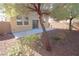 Spacious backyard with gravel landscaping and a large patio at 242 Botanic Gardens Dr, Las Vegas, NV 89148