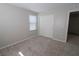 Spacious bedroom with double door closet and carpet flooring at 242 Botanic Gardens Dr, Las Vegas, NV 89148