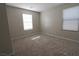 Simple bedroom with neutral walls and carpeted floor at 242 Botanic Gardens Dr, Las Vegas, NV 89148