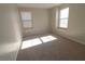 Bright bedroom featuring neutral walls and carpet at 242 Botanic Gardens Dr, Las Vegas, NV 89148