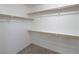 Large walk-in closet with shelves and hanging rods at 242 Botanic Gardens Dr, Las Vegas, NV 89148