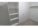 Walk-in closet with built-in shelving and hanging rods at 242 Botanic Gardens Dr, Las Vegas, NV 89148