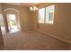 Bright dining room with carpeted floors and a chandelier at 242 Botanic Gardens Dr, Las Vegas, NV 89148