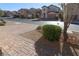 Landscaped front yard with a brick walkway and neighborhood view at 242 Botanic Gardens Dr, Las Vegas, NV 89148