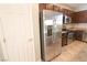 Kitchen with stainless steel appliances and dark brown cabinets at 242 Botanic Gardens Dr, Las Vegas, NV 89148