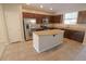 Island kitchen with stainless steel appliances at 242 Botanic Gardens Dr, Las Vegas, NV 89148