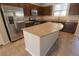 Kitchen with a large granite island and stainless steel appliances at 242 Botanic Gardens Dr, Las Vegas, NV 89148