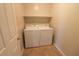 Laundry room with washer and dryer, and shelving at 242 Botanic Gardens Dr, Las Vegas, NV 89148