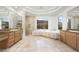 Elegant bathroom with dual vanities, a soaking tub, and a walk-in shower at 2475 Grassy Spring Pl, Las Vegas, NV 89135