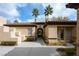 Spanish style home with arched entryway and courtyard at 2475 Grassy Spring Pl, Las Vegas, NV 89135