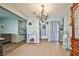 Inviting entryway with neutral color palette, chandelier, and tile floors, creating a warm and welcoming atmosphere at 2540 Eagle St, Las Vegas, NV 89142