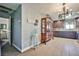 Inviting entryway with neutral color palette, chandelier, and tile floors, creating a warm and welcoming atmosphere at 2540 Eagle St, Las Vegas, NV 89142