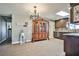 Open concept kitchen and dining room with dark wood cabinets and tile floors at 2540 Eagle St, Las Vegas, NV 89142