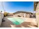 A backyard pool offers a refreshing escape with a concrete patio, perfect for relaxation and outdoor enjoyment at 2540 Eagle St, Las Vegas, NV 89142