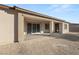 Expansive backyard featuring a covered patio with sliding glass doors, offering seamless indoor-outdoor living at 2669 Pioneer Estates Ct, Las Vegas, NV 89117