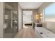 Luxurious bathroom with soaking tub, walk-in shower, and modern finishes at 2669 Pioneer Estates Ct, Las Vegas, NV 89117