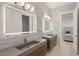 Bathroom with double sinks, modern lighting, and wave tile at 2669 Pioneer Estates Ct, Las Vegas, NV 89117