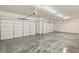 Large three-car garage with epoxy floor and high ceilings at 2669 Pioneer Estates Ct, Las Vegas, NV 89117