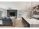 Modern kitchen with marble countertops and large island, perfect for entertaining at 2669 Pioneer Estates Ct, Las Vegas, NV 89117