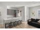 Modern kitchen with white quartz island and gray cabinetry at 2669 Pioneer Estates Ct, Las Vegas, NV 89117