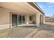 Covered patio with pavers, sliding glass doors, and a small table at 2669 Pioneer Estates Ct, Las Vegas, NV 89117