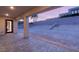 Covered patio at dusk overlooking a sloped backyard at 2669 Pioneer Estates Ct, Las Vegas, NV 89117