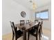 Dining room with a dark wood table and six chairs at 2682 Korea Ct, Henderson, NV 89052