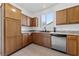 Well-equipped kitchen featuring ample wood cabinetry and granite countertops at 2682 Korea Ct, Henderson, NV 89052