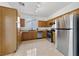 Kitchen with stainless steel appliances and wood cabinets at 2682 Korea Ct, Henderson, NV 89052