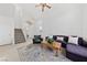 Living room with a sectional sofa and a view of the entryway and staircase at 2682 Korea Ct, Henderson, NV 89052