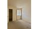 Simple bedroom with carpet flooring, window, and closet at 2725 S Nellis Blvd # 2036, Las Vegas, NV 89121